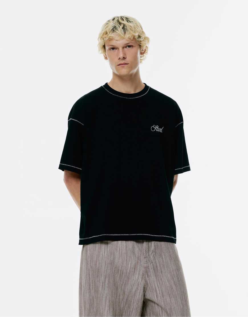 Pull & Bear - T-Shirt in Schwarz mit Kontrastnaht und „STWD Studio"-Print von Pull & Bear