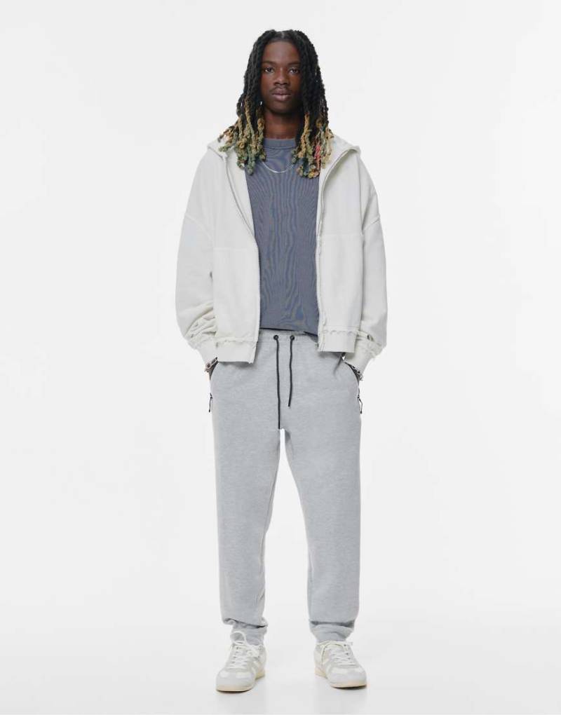 Pull & Bear - Trainingsanzug-Jogginghose in meliertem Grau Pull & Bear - Trainingsanzug-Jogginghose in meliertem Grau von Pull & Bear