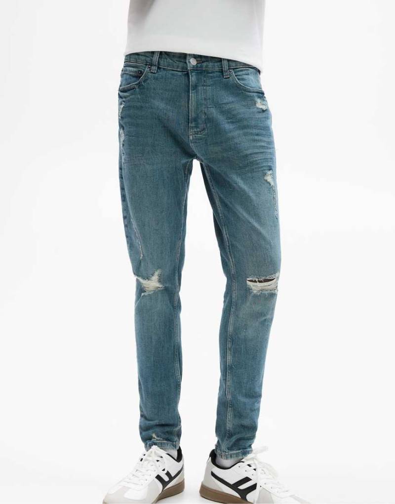 Pull & Bear - Zerrissene Skinny-Jeans in Neonblau von Pull & Bear