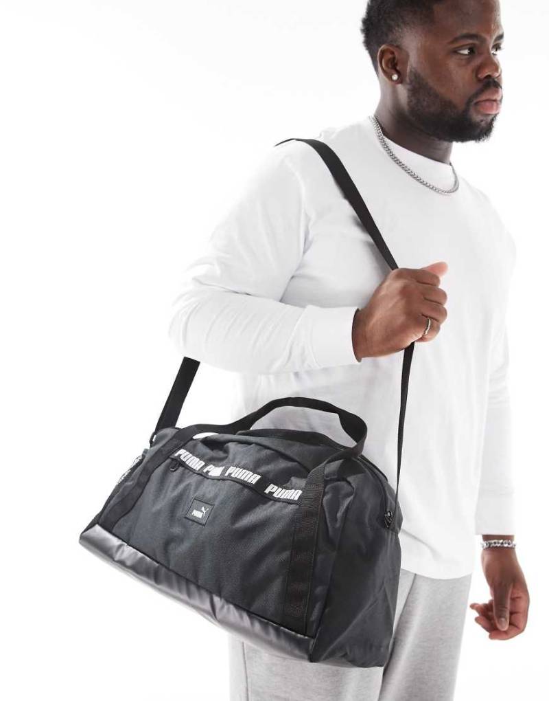 PUMA - Phase - Kleine Sporttasche in Schwarz mit Zierband von Puma