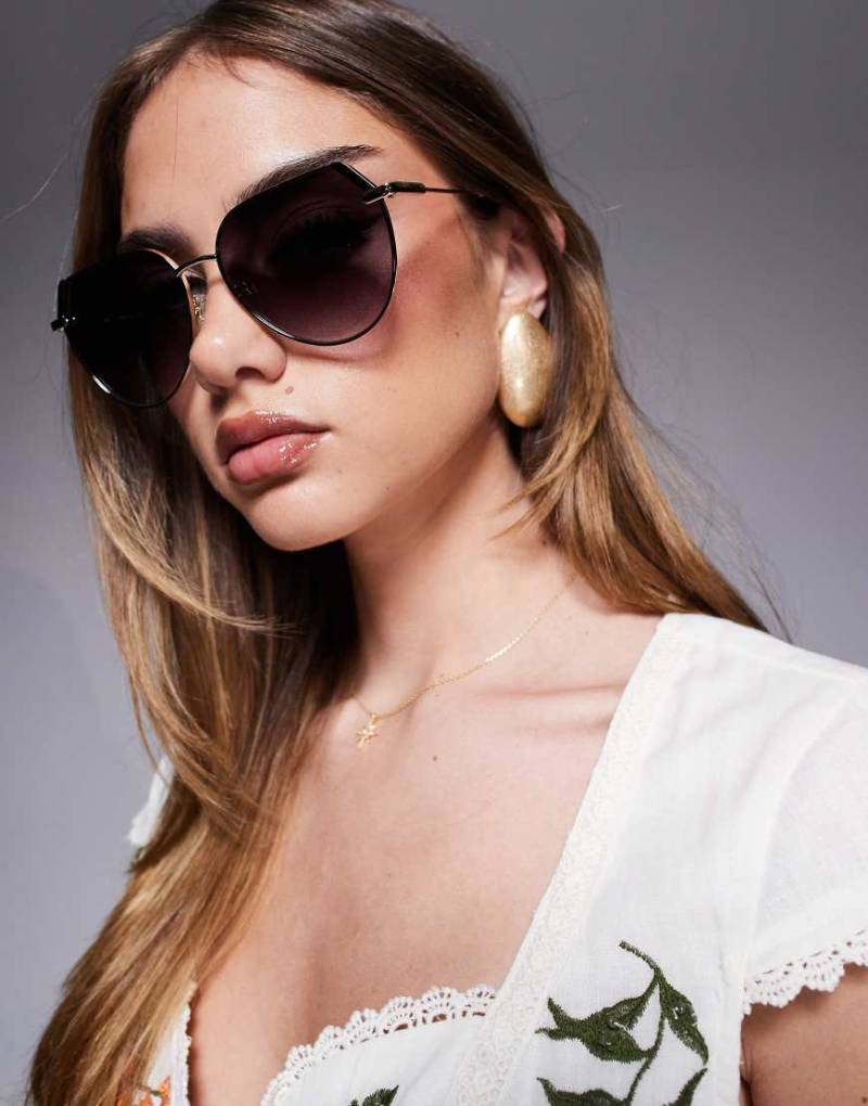 Quay - Main Character - Runde Oversize-Sonnenbrille aus schwarzem und goldfarbenem Metall von Quay Australia