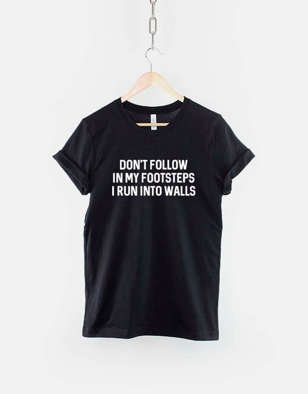 Don't Walk in My Footsteps I Run Into Walls T-Shirt von QuriousShop