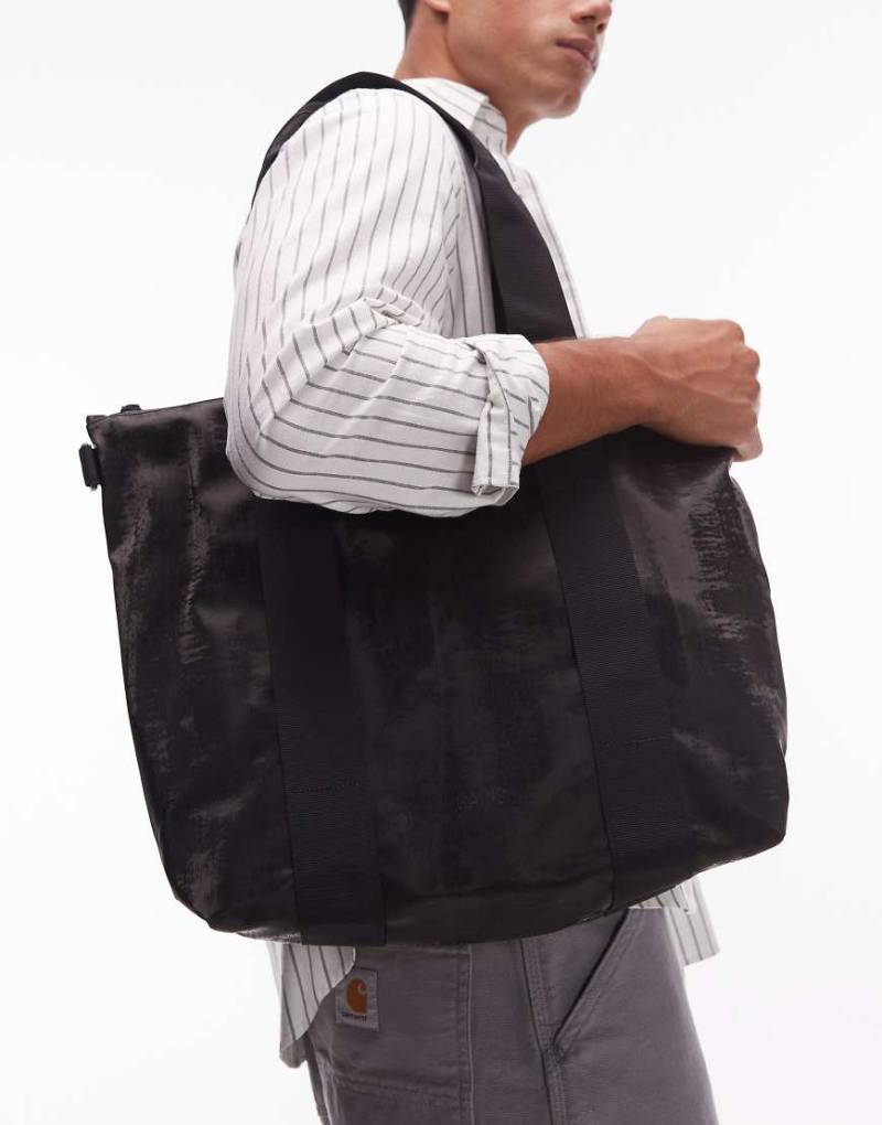 Rains - Kleine wasserdichte Tragetasche in Schwarz von Rains