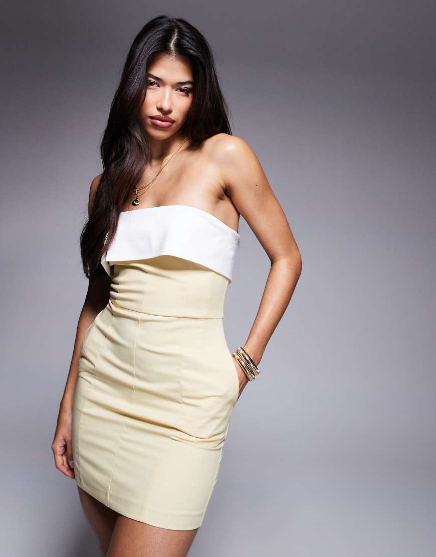 Rare London - Elegantes, trägerloses Minikleid in Buttergelb mit Kontrastdetails und umgeschlagenem Ausschnitt Rare London - Elegantes, trägerloses Minikleid in Buttergelb mit Kontrastdetails und umgeschlagenem Ausschnitt von Rare