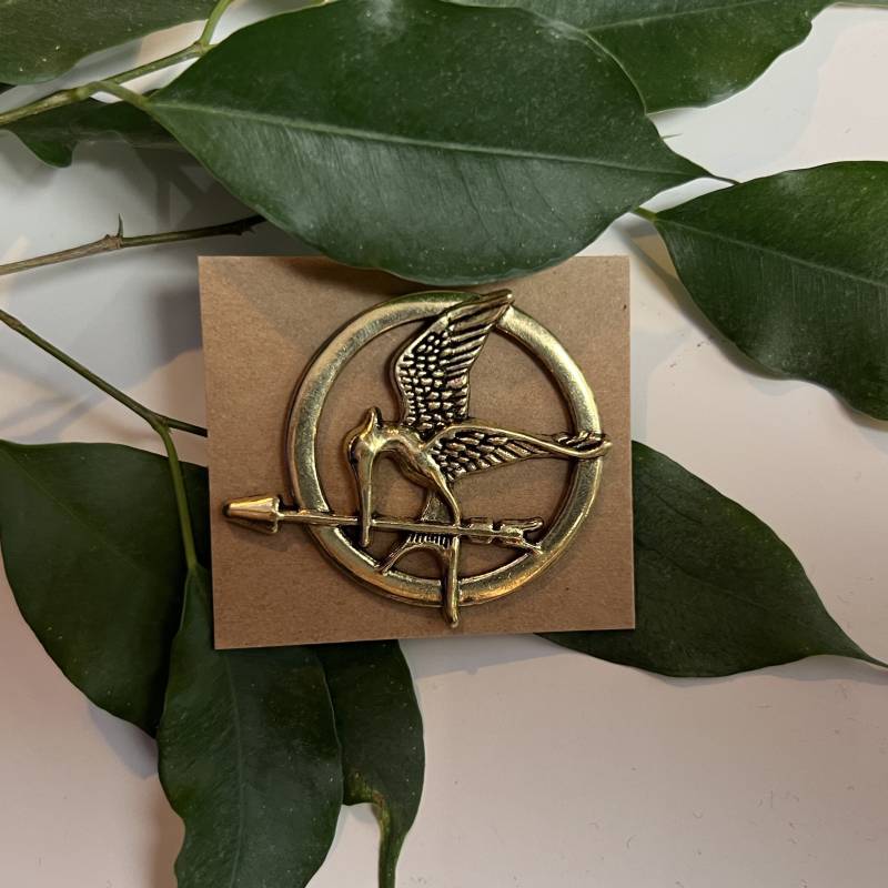 Metall Pin Spotttölpel - Tribute Von Panem Metall Pin Spotttölpel - Tribute Von Panem von ReadingBookShop