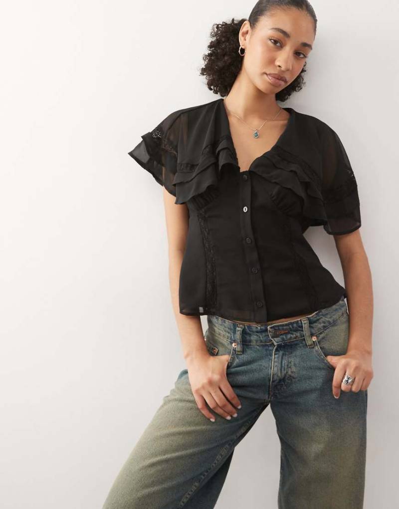 Reclaimed Vintage - Freizeitoberteil in Schwarz mit Cape-Kragen von Reclaimed Vintage