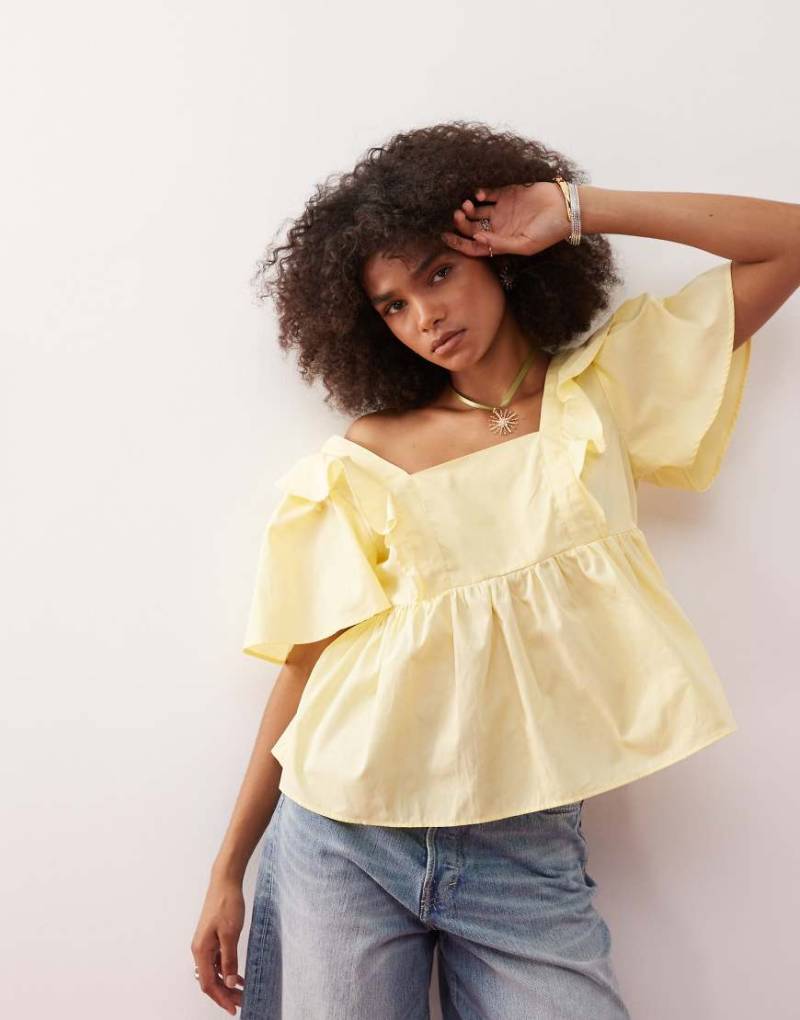 Reclaimed Vintage - Hängeroberteil in Buttermilchgelb im Babydoll-Stil mit Rüschen von Reclaimed Vintage