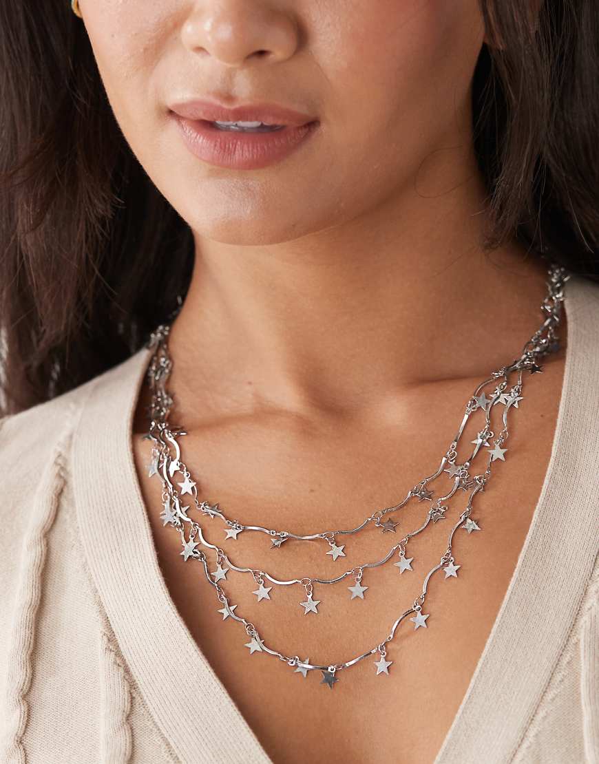 Reclaimed Vintage - Lange, mehrlagige Halskette mit silberfarbenen Sterndetails Reclaimed Vintage - Lange, mehrlagige Halskette mit silberfarbenen Sterndetails von Reclaimed Vintage