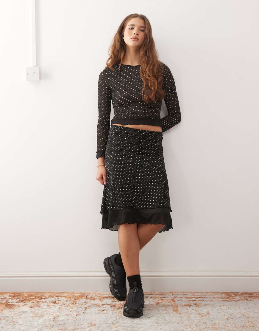 Reclaimed Vintage - Midirock mit Punktemuster und Kontrastrand-Schwarz Reclaimed Vintage - Midirock mit Punktemuster und Kontrastrand-Schwarz von Reclaimed Vintage