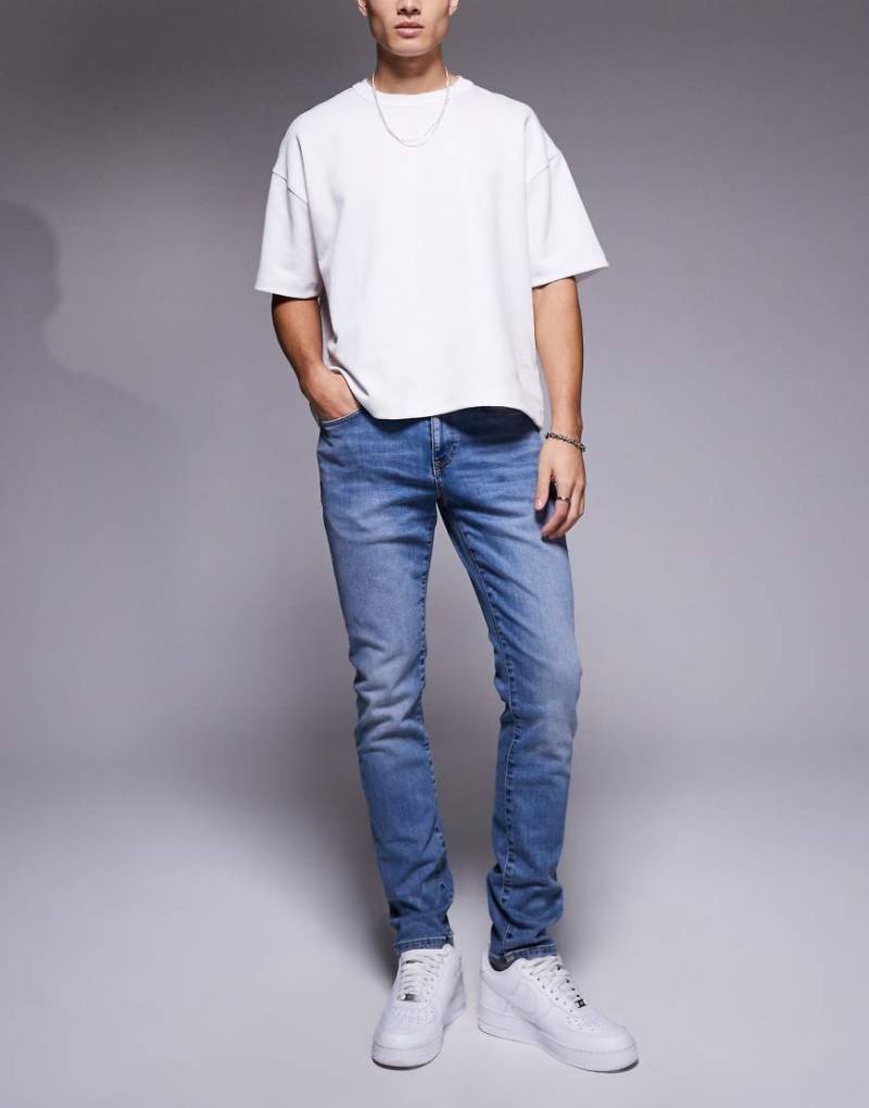 River Island - Enge Jeans in verwaschenem Mittelblau von River Island