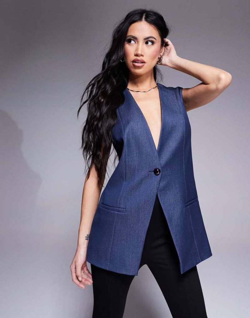 River Island - Longline-Jeansweste in mittelblauer Waschung River Island - Longline-Jeansweste in mittelblauer Waschung von River Island