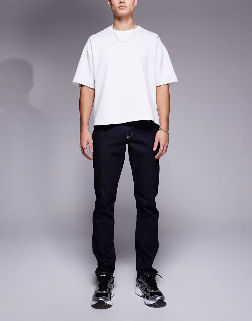 River Island - Schmal geschnittene Jeans in indigoblauer Waschung-Marineblau von River Island