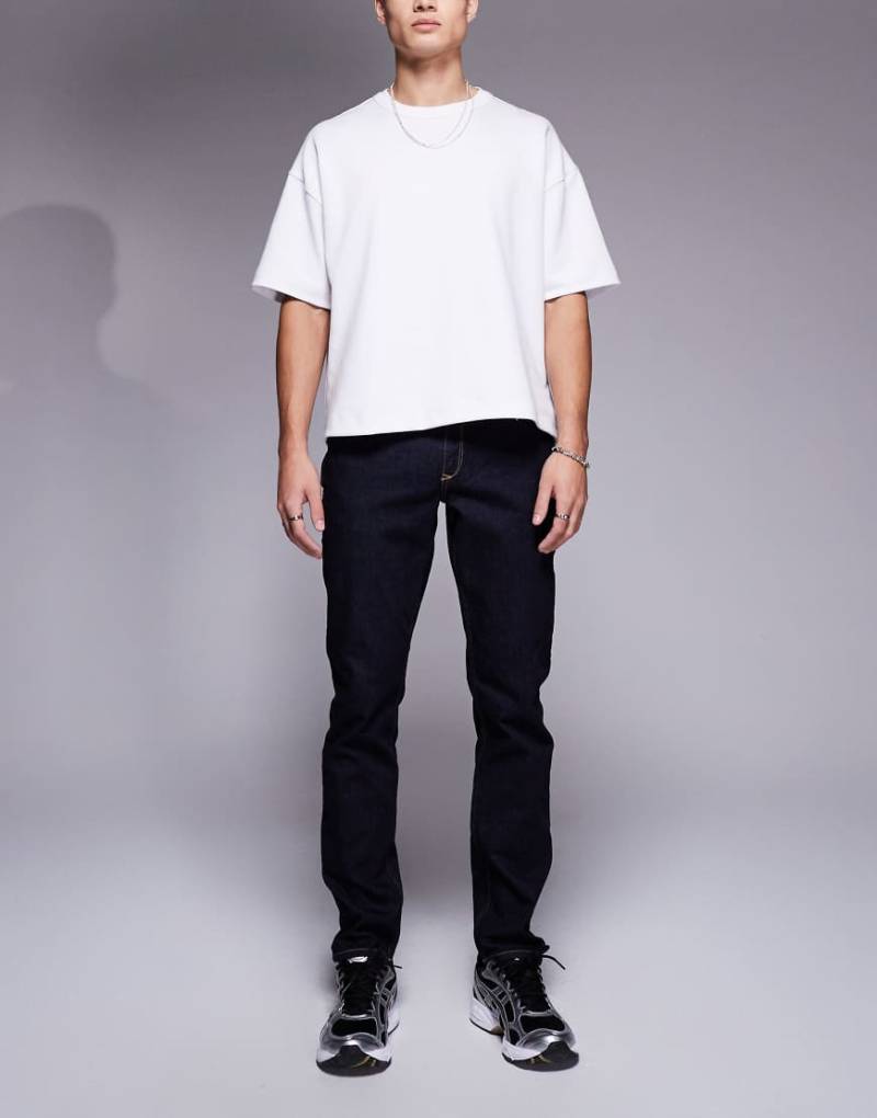 River Island - Schmal geschnittene Jeans in indigoblauer Waschung-Marineblau von River Island