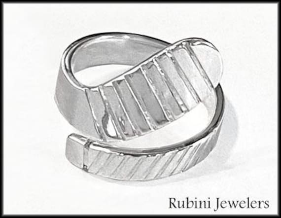 Großer Eishockeyschläger Wickelring Aus Sterlingsilber Von Rubini Jewellers Großer Eishockeyschläger Wickelring Aus Sterlingsilber Von Rubini Jewellers von RubiniJewelersSports