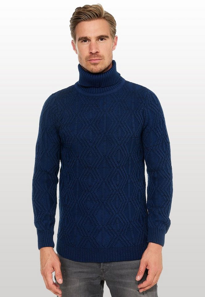 Rusty Neal Rollkragenpullover in modischem Design von Rusty Neal