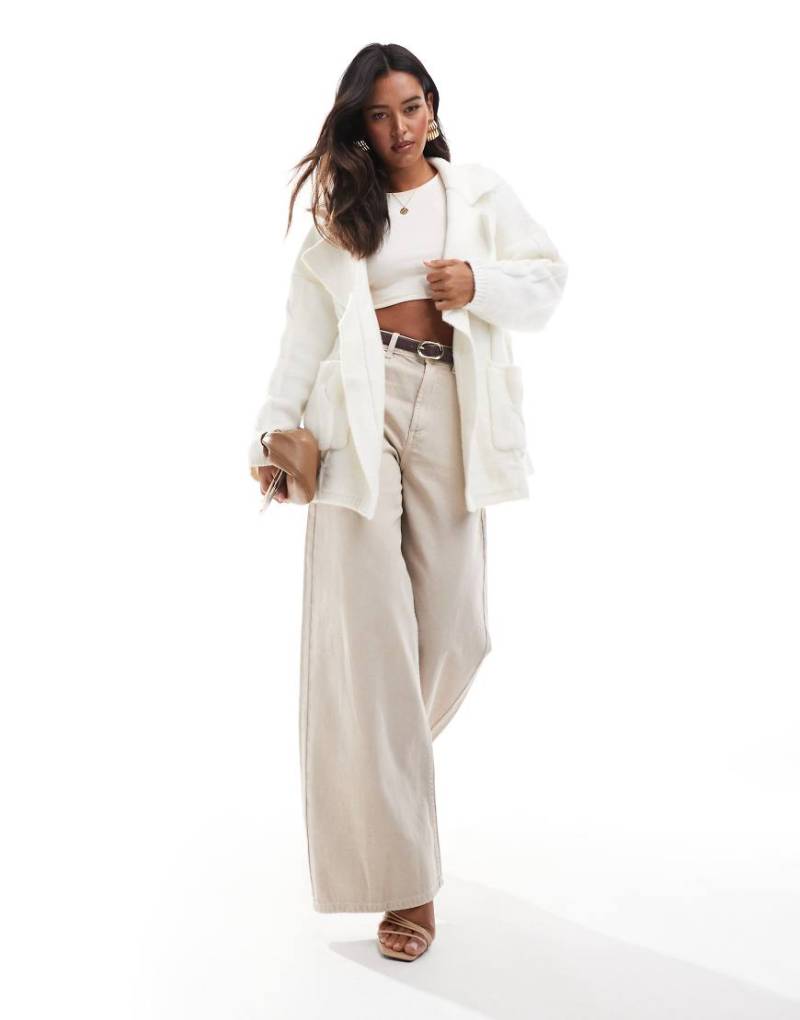 SNDYS - Premium - Strickjacke in Creme mit Zopfmuster-Weiß SNDYS - Premium - Strickjacke in Creme mit Zopfmuster-Weiß von SNDYS
