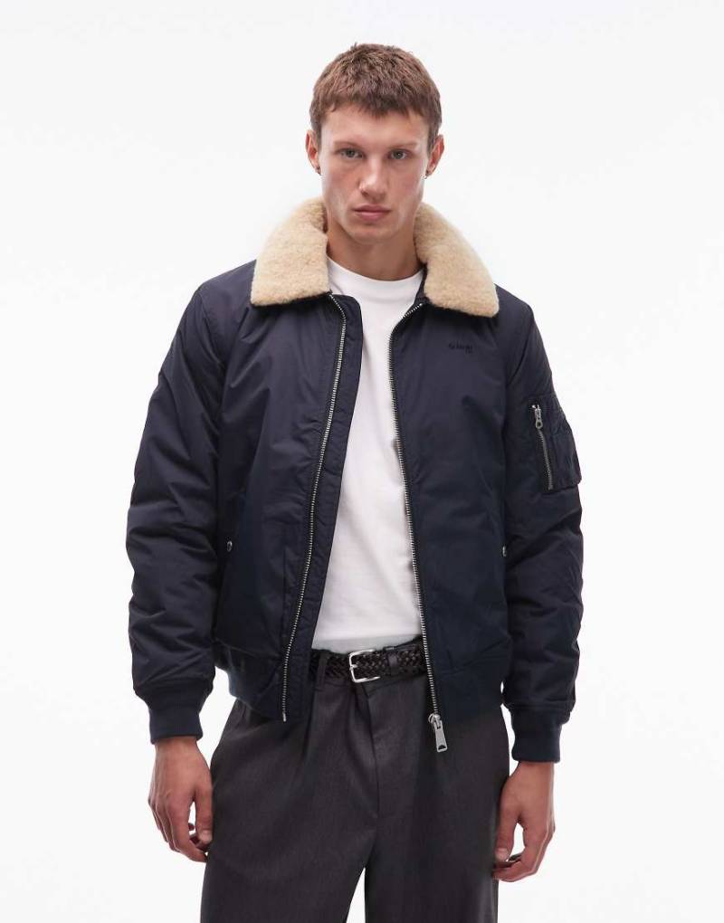 Schott - Wattierte Cropped-Fit-Jacke in Marineblau mit Logo-Aufnäher, Reißverschlusstaschen und Kunstpelzkragen-Grün von Schott