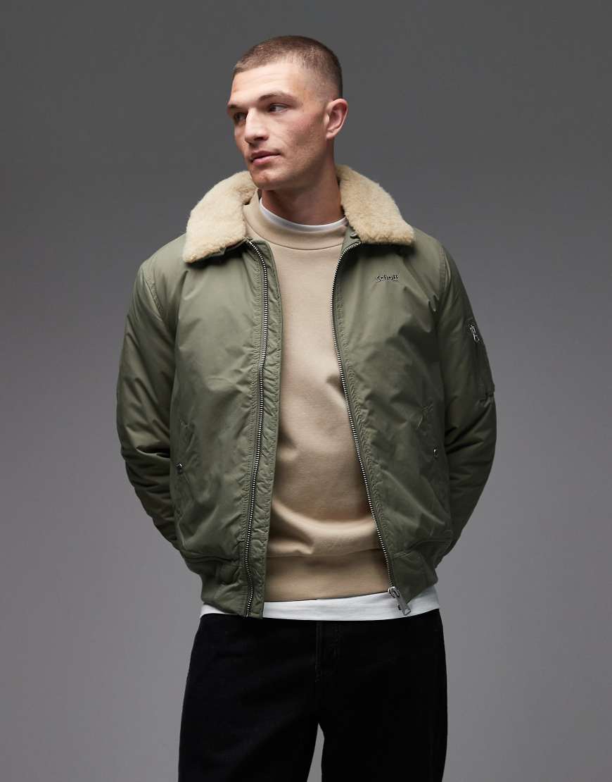 Schott - Wattierte Cropped Jacke in Salbeigrün/Beige mit Logo-Aufnäher, Reißverschlusstaschen und Kunstpelzkragen von Schott