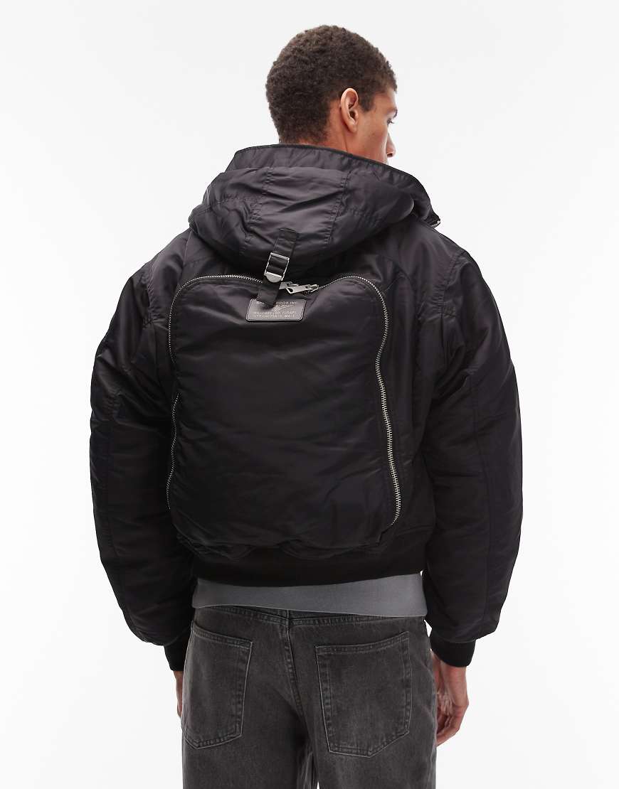 Schott - Wattierte Cropped-Jacke in Schwarz mit Logoaufnäher, Reißverschlusstasche und Rucksackdetail von Schott