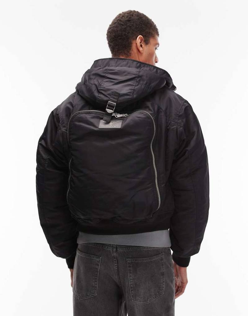 Schott - Wattierte Cropped-Jacke in Schwarz mit Logoaufnäher, Reißverschlusstasche und Rucksackdetail von Schott