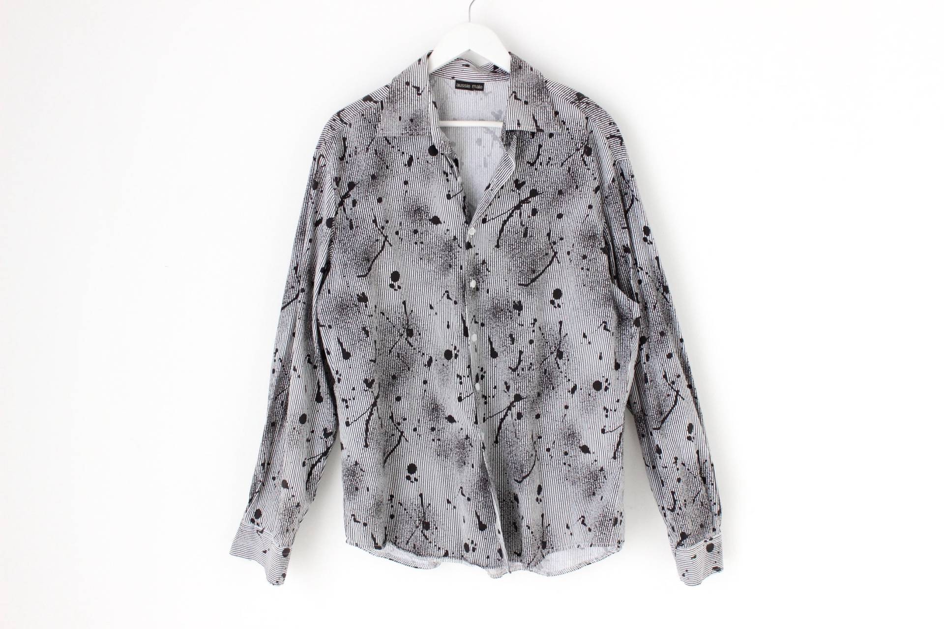 Y2K Farbspritzer & Nadelstreifen Abstrakter Druck Langarm Button Up 00S Club Party Shirt - Acne Vibes Y2K Farbspritzer & Nadelstreifen Abstrakter Druck Langarm Button Up 00S Club Party Shirt - Acne Vibes von ScruffyJays