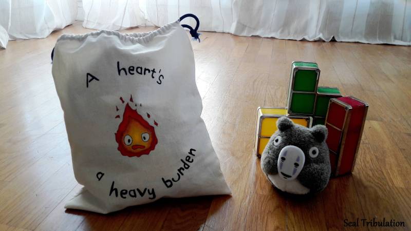 Fiameta Beuteltasche - Handbemalte Kordelzugtasche Aus Baumwolle Mit Flammenmuster Fiameta Beuteltasche - Handbemalte Kordelzugtasche Aus Baumwolle Mit Flammenmuster von SealTribulation
