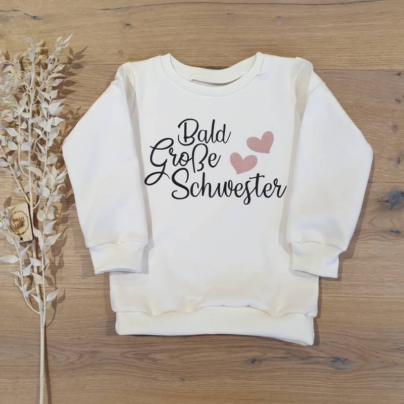 Cremeweiss | Weiss - Bald Große Schwester | Schwarz-Rosegold Sweater Von Sharlene Babymode Handmade in Germany von SharleneBabymode