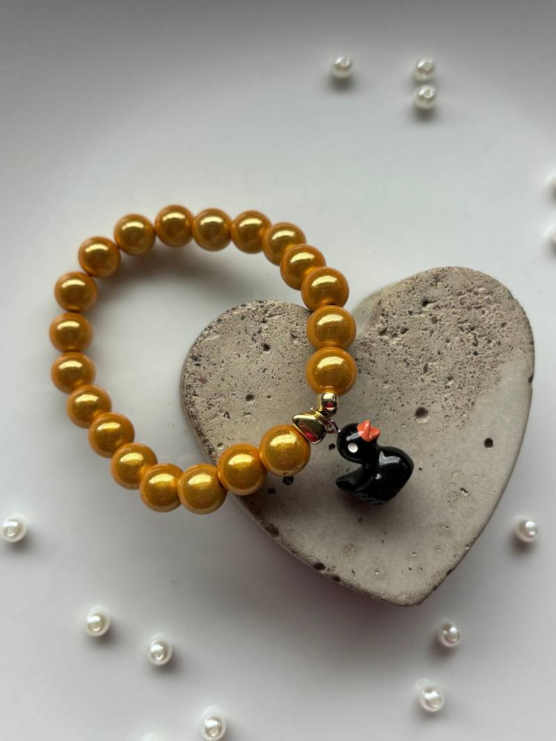 Magic Perlen Armband Mit Magisch Glänzenden Und Entchenanhänger Magic Perlen Armband Mit Magisch Glänzenden Und Entchenanhänger von SirWoddy