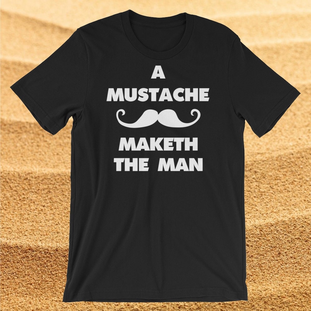 Ein Schnurrbart Macht Den Mann. Kurzarm Unisex T-Shirt Ein Schnurrbart Macht Den Mann. Kurzarm Unisex T-Shirt von SlapCatDesigns