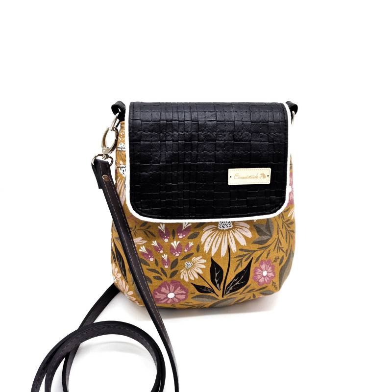 Kleine Handtasche Mit Klappe Und Verspieltem Blumenmuster in Schwarz Senfgelb Kleine Handtasche Mit Klappe Und Verspieltem Blumenmuster in Schwarz Senfgelb von Snoozeboo