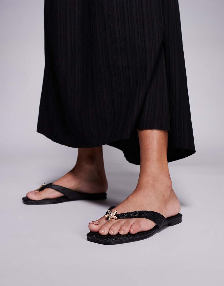 South Beach - Zehenstegsandalen aus Bast in Schwarz mit Seestern-Verzierung von South Beach