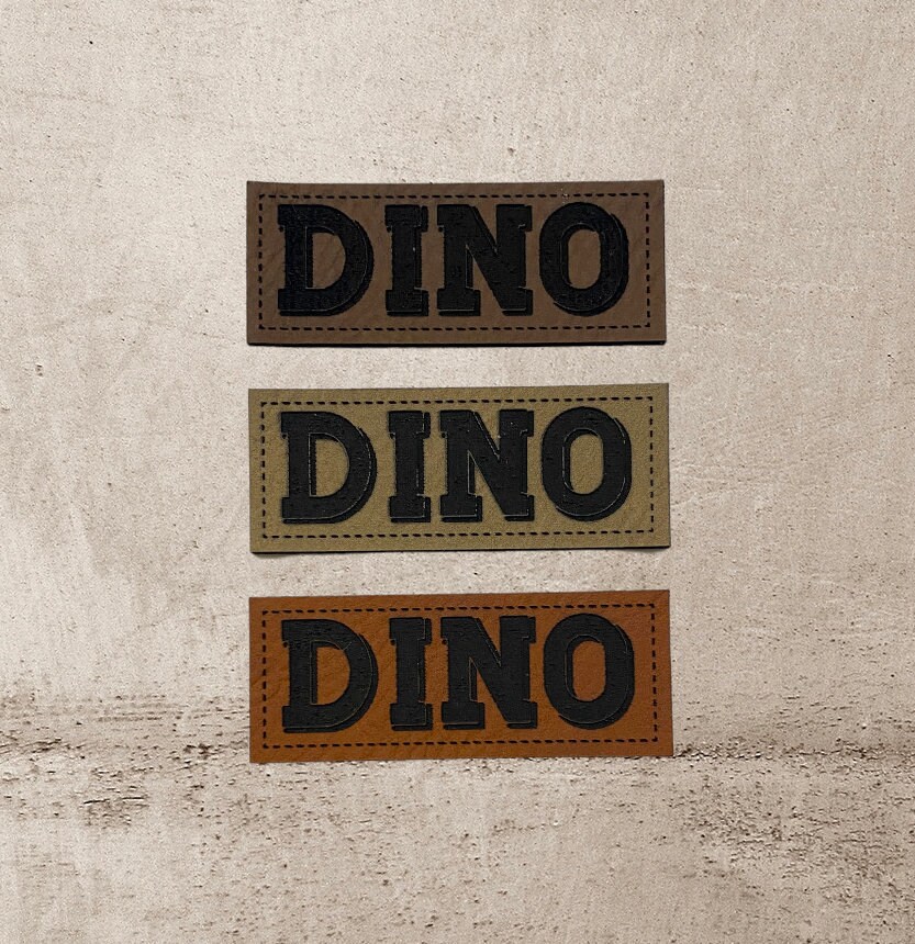 Kunstleder Label | 2x5 cm Dino Patch Aufnäher Patches Etiketten Verschiedene Farben Kunstleder Label | 2x5 cm Dino Patch Aufnäher Patches Etiketten Verschiedene Farben von Stoeffchendealer