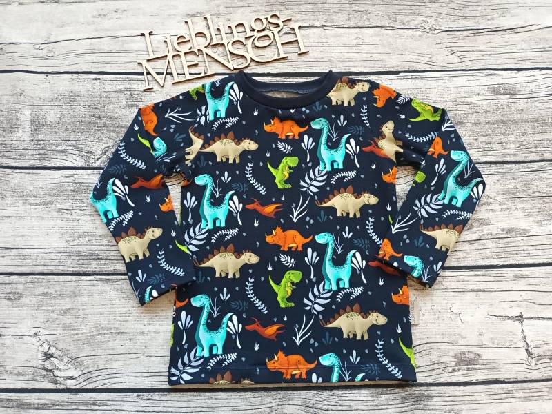 Langarmshirt Dinosaurier - Pullover Unisex Für Mädchen Und Jungs Blauschwarz/Bunt von Stoffloewe