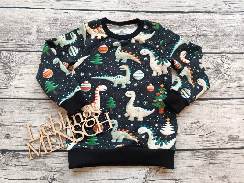 Sweatshirt Weihnachtsdinos - Weihnachtspullover Dinosaurier Für Mädchen Und Jungs Schwarz/Bunt von Stoffloewe
