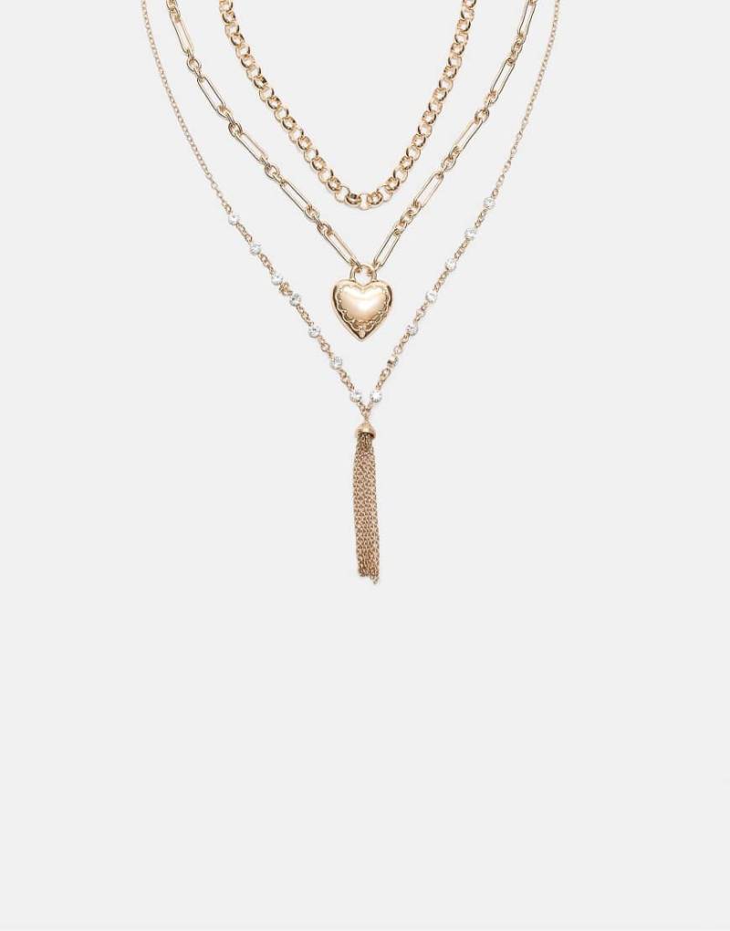 Stradivarius - 3er-Set Halsketten in Gold-Optik mit Herzdetail und Quaste-Gelb Stradivarius - 3er-Set Halsketten in Gold-Optik mit Herzdetail und Quaste-Gelb von Stradivarius