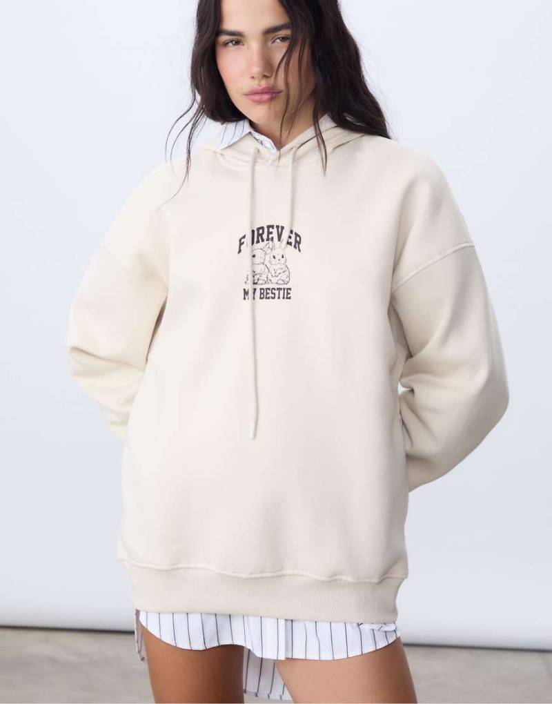Stradivarius - Kapuzenpullover in Steinbeige mit Grafikprint-Weiß von Stradivarius