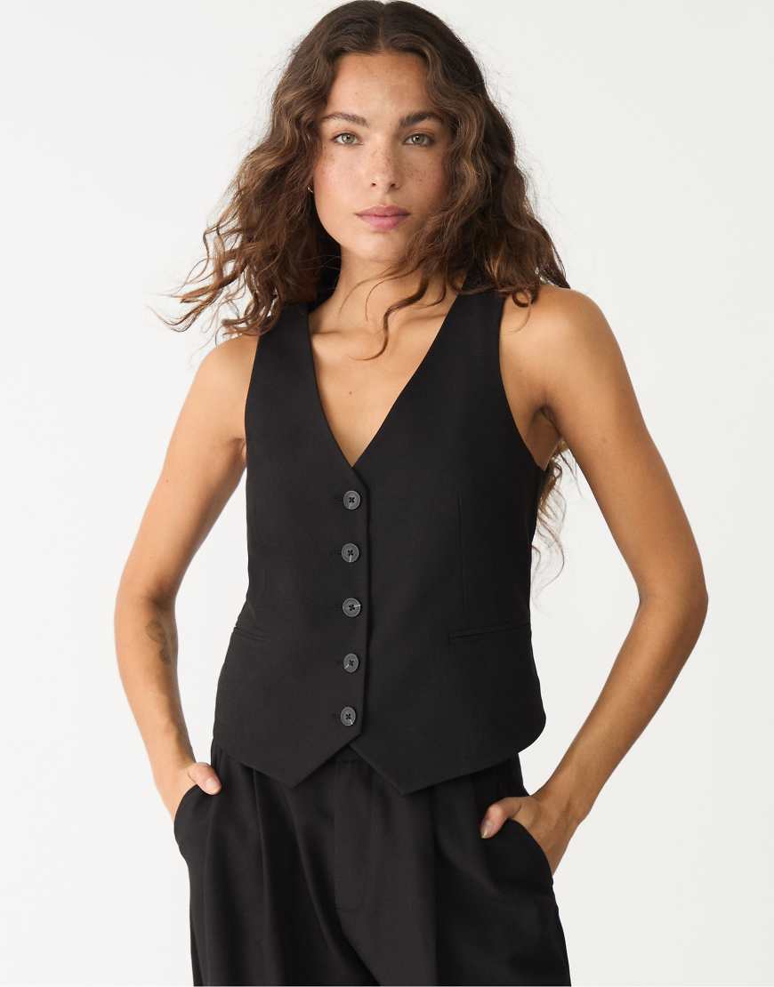 Stradivarius - Kurze Weste in Schwarz mit Knopfleiste von Stradivarius