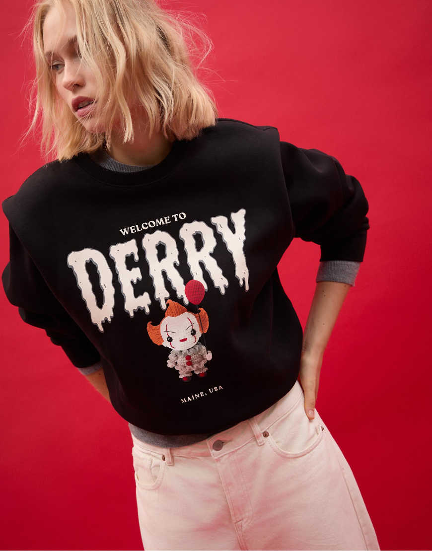 Stradivarius - Sweatshirt in Schwarz mit Schulterpolstern und „ES"-Grafik von Stradivarius