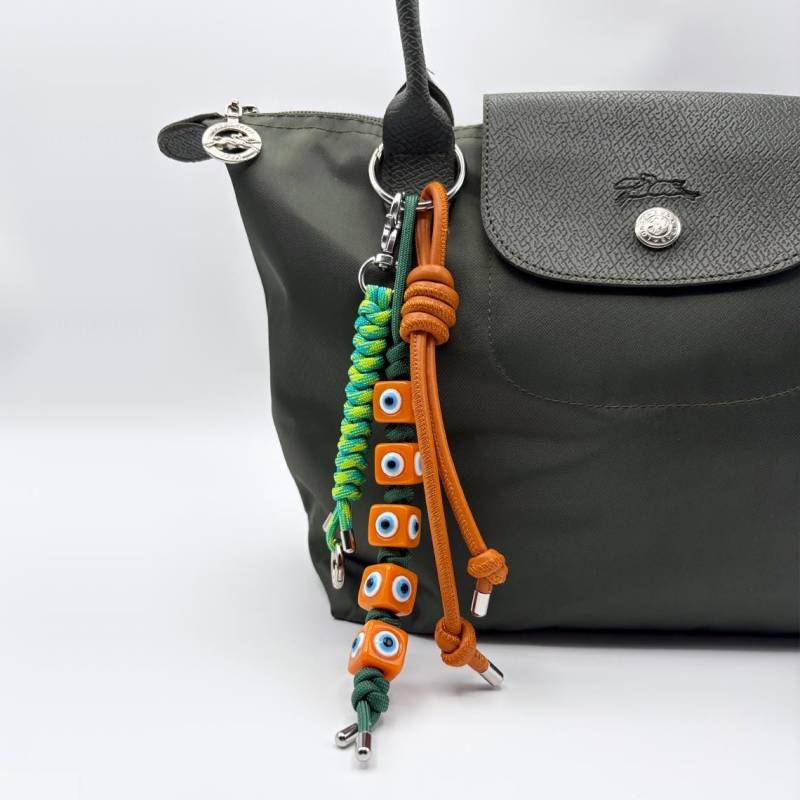 Evil Eye Paracord Taschenanhänger Handgefertigter Schlüsselanhänger Aus Leder Mit Karabiner Evil Eye Paracord Taschenanhänger Handgefertigter Schlüsselanhänger Aus Leder Mit Karabiner von StudioTempleTrash