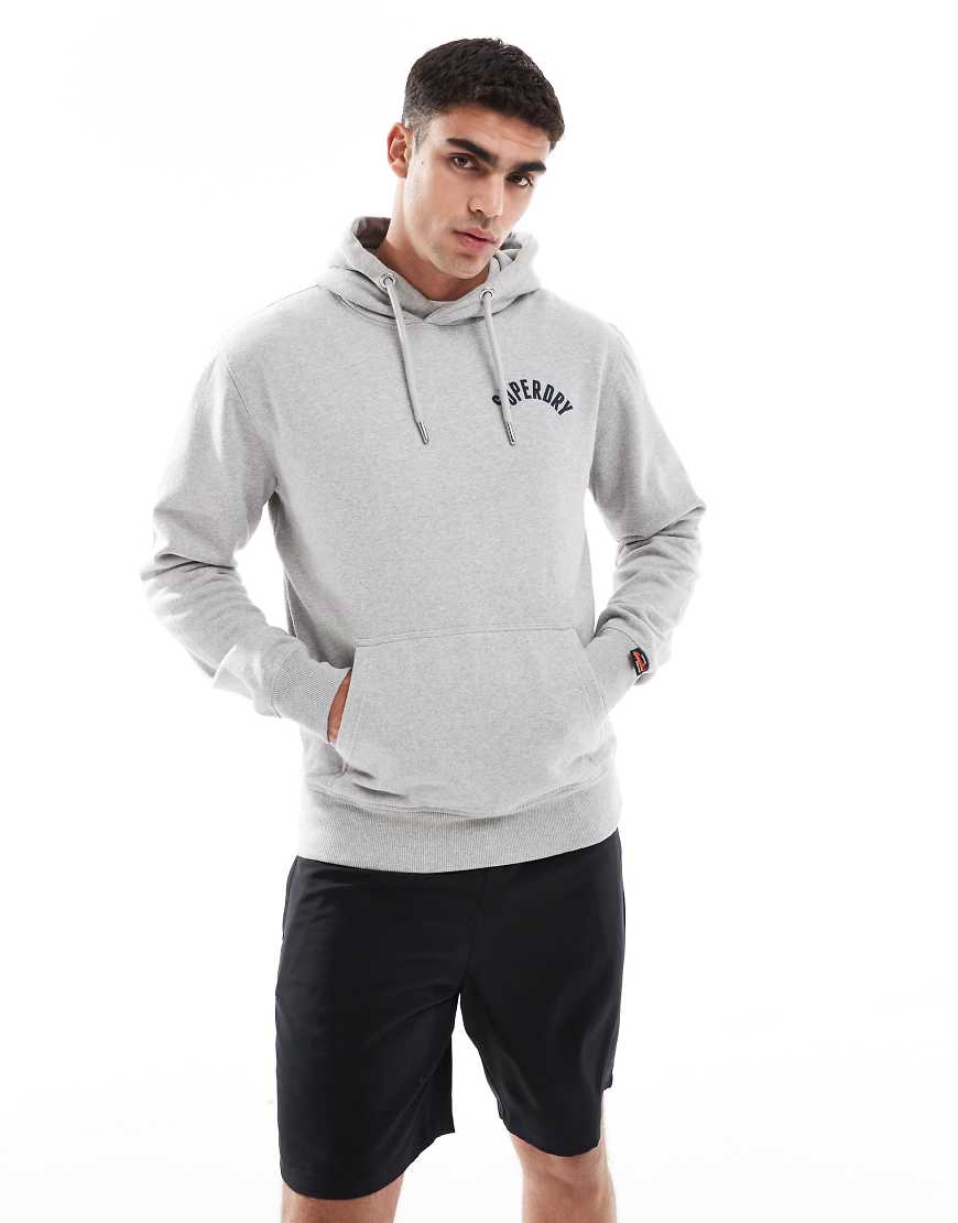 Superdry - Athletic Essentials - Kapuzenpullover in Grau meliert Superdry - Athletic Essentials - Kapuzenpullover in Grau meliert von Superdry