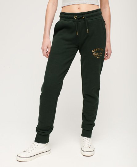 Superdry Damen Schmal Geschnittene Luxe Jogginghose mit Logo in Metallic-Optik Grün - Größe: 34 von Superdry