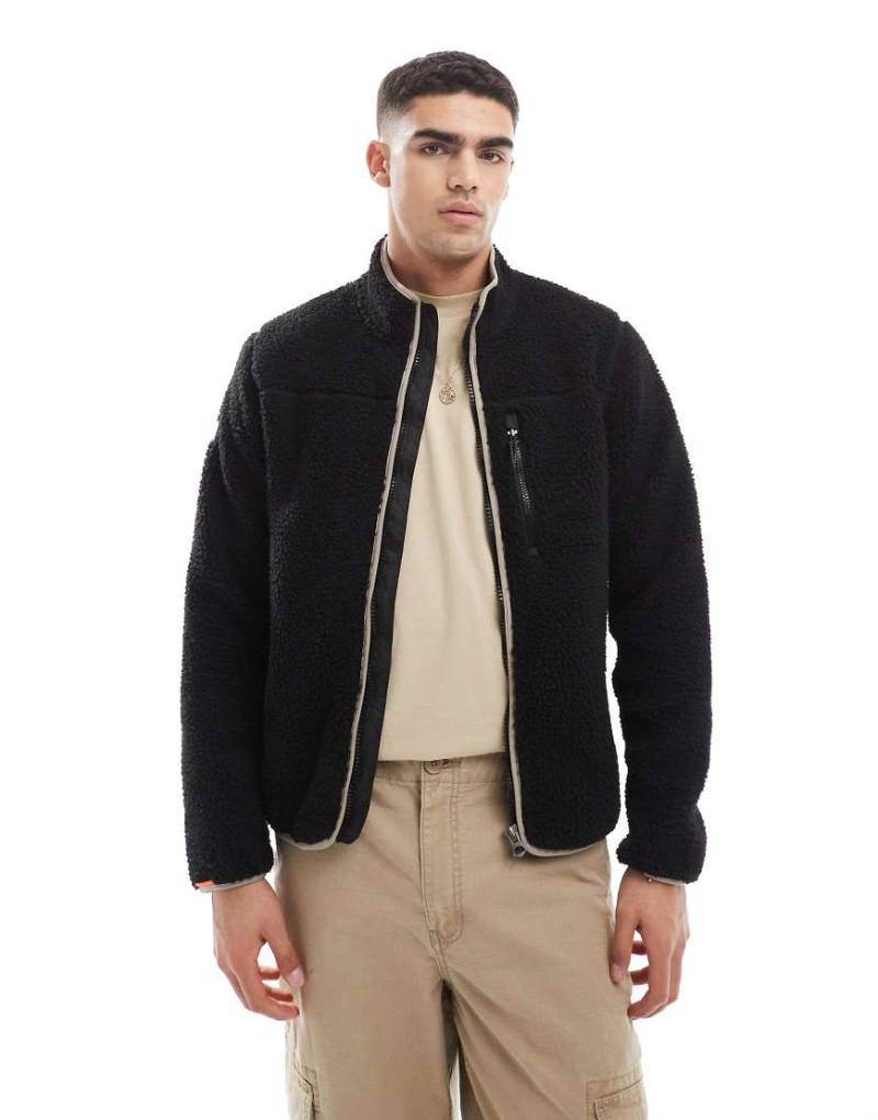 Superdry - Outdoor - Fleece-Jacke in Contrast-Schwarz mit durchgehendem Reißverschluss Superdry - Outdoor - Fleece-Jacke in Contrast-Schwarz mit durchgehendem Reißverschluss von Superdry