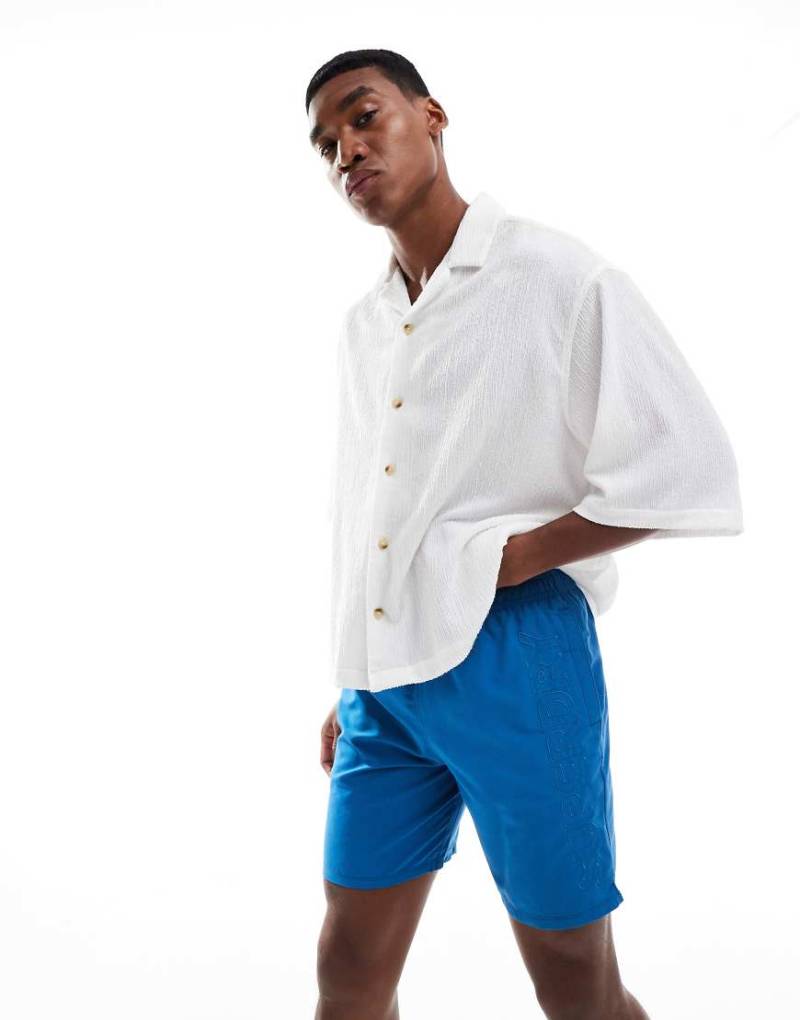 Superdry - Premium - Bestickte Badeshorts in Twilight Blue, 17 Zoll Schrittlänge-Blau von Superdry