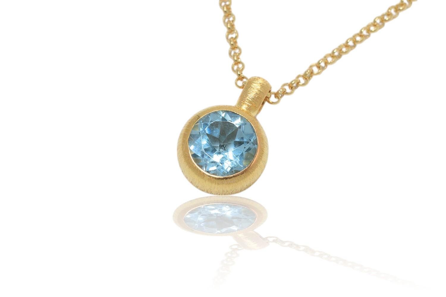 Blautopas 18K Gold/Silber Anhänger. Länge 16mm Blautopas 18K Gold/Silber Anhänger. Länge 16mm von SwankyElements