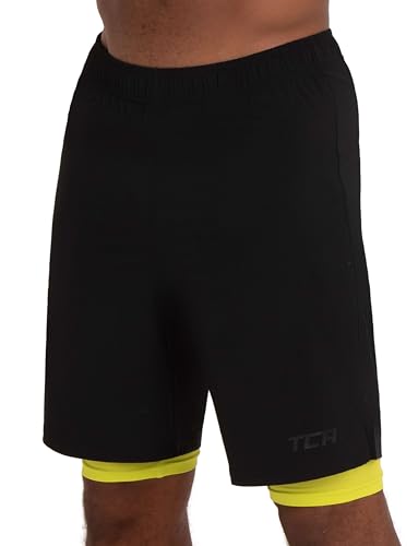 TCA Ultra Sporthose Herren kurz 2 in 1 mit Tasche - Kurze Sport Shorts Trainingshose mit Taschen - Laufhose mit Kompressions Innenhose und Reißverschluss Handytasche - Schwarz/Grün, XL von TCA