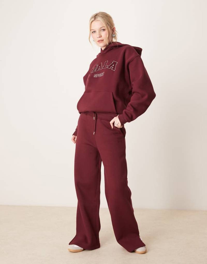Tala - Jogginghose in Burgunderrot mit weitem Bein und Logo von Tala