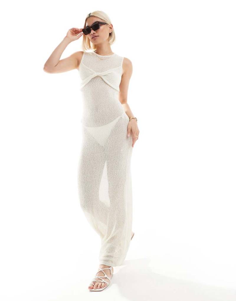 The Frolic - Exklusives, ärmelloses Maxi-Strandkleid aus Strick in Cremeweiß mit verdrehtem Design an der Brustpartie von The Frolic