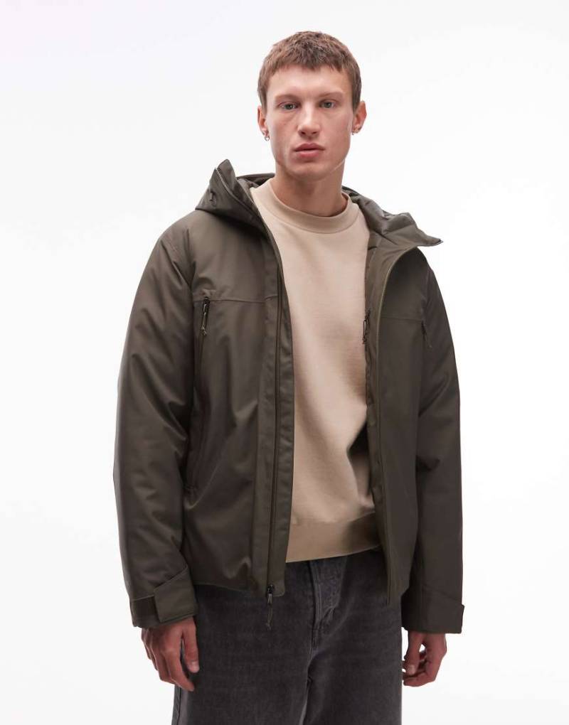 The North Face - MTN Range - Wasserdichter, isolierter Daunenjacke in Dunkelgrün mit Kapuze The North Face - MTN Range - Wasserdichter, isolierter Daunenjacke in Dunkelgrün mit Kapuze von The North Face