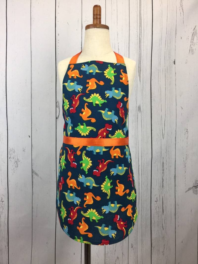 Kinderschürze Dinosaurier-Druck, Bastel - & Backschürze Aus Baumwolle Kinderschürze Dinosaurier-Druck, Bastel - & Backschürze Aus Baumwolle von TheCraftLadyCo