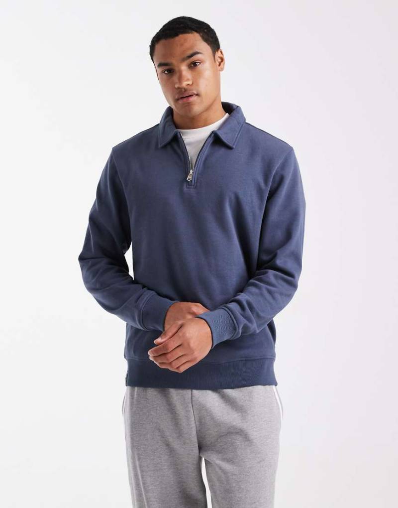 Threadbare - Fleece-Sweatshirt in Blau mit kurzem Reißverschluss Threadbare - Fleece-Sweatshirt in Blau mit kurzem Reißverschluss von Threadbare